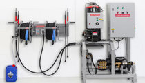 Frequency controlled high-pressure aggregate for up to 3,000 l/h or 4,200  l/h and integrated hot-water unit MBHot, infinitely variable up to 90° C. The illustrated operating panel includes hose reels for two simultaneously working users. Therefore it is possible to place the pump unit inside the equipment room and the hose panel at the washing area.