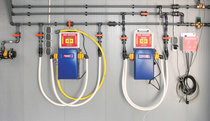 Water distribution inside pigsty with two permanently integrated electrical medication dosing systems - both with MBDos1. This arrangement facilitates parallel dosing of acids and medication into the drinking water.